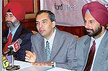 Mr V. Sivaramakrishnan, General Manager, Sales, (centre) Ford India, addresses a press conference