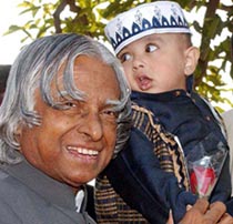 President A.P.J. Abdul Kalam receives a rose from a child on the occasion of Id at Rashtrapati Bhavan in New Delhi on Wednesday. 