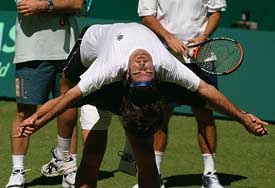 Carlos Moyer of Spain stretches during a practice session at Rod Laver Arena in preparation for the upcoming Davis Cup final against Australia
