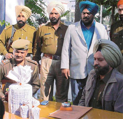 Davinder Singh (wearing coat) from whom 3 kg of opium was seized by the Sarabha Nagar police