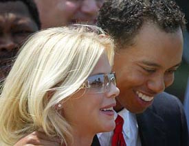 US golfer Tiger Woods with his girlfriend Elin Nordegren arrive for the opening ceremony of The Presidents Cup at Fancourt, South Africa, in this November 20, 2003 file photograph