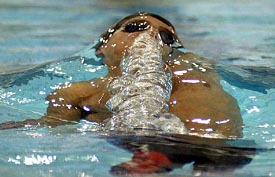 Australia's Matt Welsh breaths out as he comes up to the surface during his World Cup record breaking 50 meter backstroke final during the World Cup Swimming championship sin Melbourne 