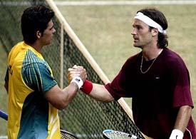 Australia's Mark Philippoussis congratulates Spain's Carlos Moya after Moya defeated Philippoussis in the first second rubber of the Davis Cup final in Melbourne