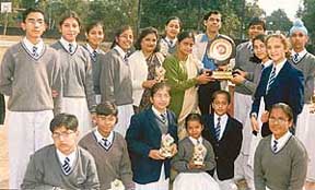 Students and teachers of Manav Mangal High School, Sector 21, with the running trophy at the premises of Moti Ram Arya Senior Secondary School