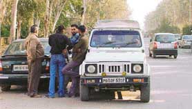 Driving on the wrong side of the road, octroi men stop a vehicle on the Chandigarh-Zirakpur stretch of the Chandigarh-Ambala highway at Bhabhat village on Friday evening. 
