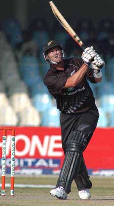 New Zealand captain Chris Cairns hits a six during his unbeaten innings of 84 