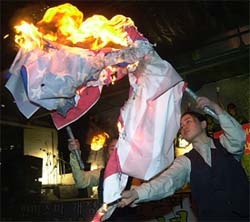 South Korean protesters burn a US flag during an anti-US rally in Seoul 