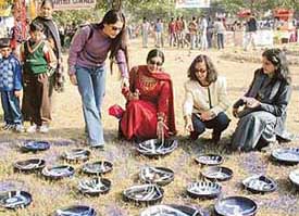 Young women delight at sight of painted plates