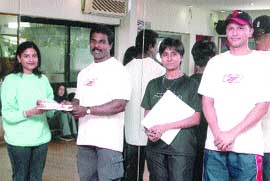 �Mr India� Prasad Kumar G presenting the Instructor Certification Programme certificates to successful candidates in the Capital in the presence of well-known trainer Nisha.
