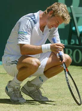 Spain's Juan Carlos Ferrero reacts after losing to Australia's Mark Philippoussis in the deciding reverse singles match