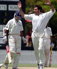 Queensland bowler Joe Dawes (R) celebrates after dismissing Indian captain Sourav Ganguly in Brisbane 