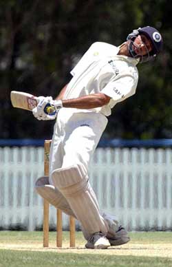 India's V.V.S. Laxman avoids a bouncer during their three-day practice match against Queensland in Brisbane 