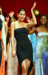 Miss Bolivia Helen Aponte Saucedo waves after winning the title of Miss World Top Personality