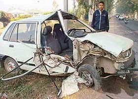 Harjit Singh, along with the remains of a car which collided head on with an Army truck infront of the Silver City colony on the Kalka-Ambala highway, near Zirakpur