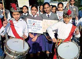 Students of Government Model Senior Secondary School, Sector 44-B, Chandigarh, hold a rally on World AIDS Day