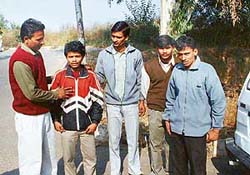 Relatives of a labourer who died in the Mandiani factory outside the Civil Hospital in Ludhiana on Monday.