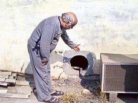 Mr Jagmohan Sharma, DCC(U) chief, shows the exhaust fan vent from where the burglars entered his shop on Monday.