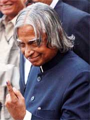 The President, Dr A.P.J. Abdul Kalam, looks at his marked finger after casting his vote