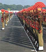 Jawans lined up during the BSF raising day parade at the BSF camp