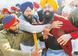 The police stops Akali workers from breaking a naka at Kurali on the Kharar-Ropar road