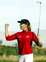 Swedish golfer Annika Sorenstam celebrates after the birdie putt for a skin, on the second hole during the final round of the $ 1 million "Skins Game" at the Trilogy Golf Club in La Quinta, California