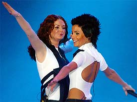 Russian pop duo Julia Volkova (R) and Lena Katina perform during the inaugural concert of their Japan tour at Tokyo Dome in Tokyo