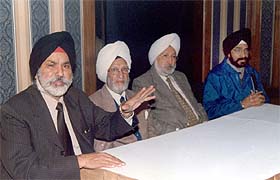 Mr Dharmbir Singh Jolly, interim president of the Chief Khalsa Diwan, addresses a press conference