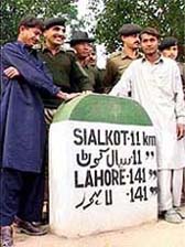 Two Pakistani boys being taken by BSF personnel for handing them over to Pakistani Rangers