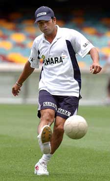 Sachin Tendulkar plays football before practice at the Gabba in Brisbane