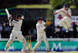 England's Paul Collingwood takes evasive action as Sri Lanka's Kumar Sangakkara hits a shot