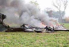 Smoke billows out from the remains of a MIG-29 aircraft which crashed near Hoshiarpur