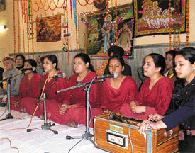 Devotees sing bhajan at the inauguration of Shri Bhagvad Gita Jayanti Samaroh organised by Brahmin Sabha