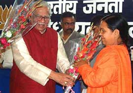 Union Minister for Petroleum and Natural Gas Ram Naik greets BJP Chief Ministerial candidate Uma Bharti 