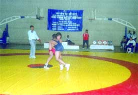 A bout in progress in the SAI Inter-Regional Wrestling Championship at the Indira Gandhi Indoor Stadium