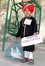 A participant at a Kid's Show, organised at Bathinda's DAV School, strikes a pose on Sunday