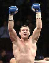 Ukrainian heavyweight boxer Vitali Klitschko raises his arms after defeating Kirk Johnson by technical knockout at Madison Square Garden in New York on Saturday