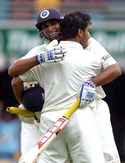 VVS Laxman hugs Sourav Ganguly after the latter reached his century