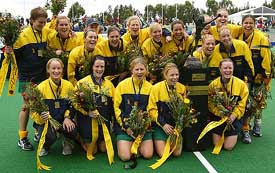Members of the Australian women's hockey team pose with the trophy after winning the Champions Trophy in Sydney on Sunday