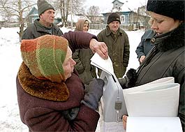 A villager casts her ballot in the village of Nosovo, 185- km west of Moscow