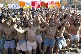 Guest workers raise slogans during a rally against forced repatriation for undocumented foreign workers in Changwon