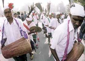 Protesters from Jharkhand perform a tribal dance as part of a protest