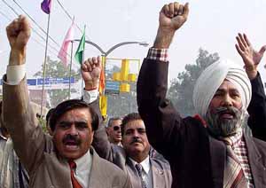 Teachers of private colleges of Punjab and Chandigarh raise slogans against the Punjab Government in Amritsar on Monday.