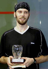 Mark Heather of England holds the Chennai Squash Open 2003 trophy in Chennai on Sunday