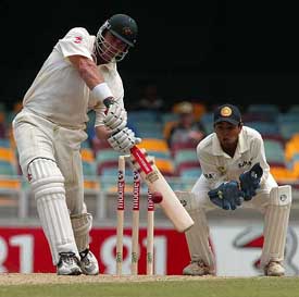Australia's Matthew Hayden smashes a ball through the off-side during the second innings of the first Test