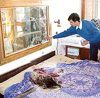 A forensic expert from Madhuban lifts fingerprints at the Panchkula house on Tuesday. 