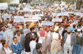 Brick-kiln owners and workers hold a rally