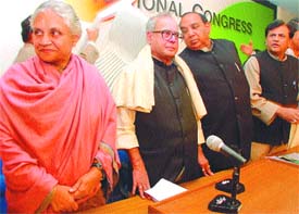 Delhi Chief Minister Sheila Dikshit, Pranab Mukherjee and DPCC president Ch. Prem Singh during a CLP meeting at AICC office