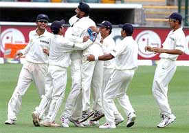 Indians celebrate the fall of Matthew Hayden on the fifth day of play in their first cricket Test 