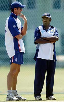 England's captain Michael Vaughan and Sri Lankan spinner Muttiah Muralitharan chat during a training session