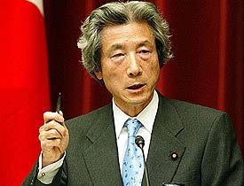 Japanese Prime Minister Junichiro Koizumi explains Japan's plan to dispatch troops to Iraq at a news conference in Tokyo on Tuesday